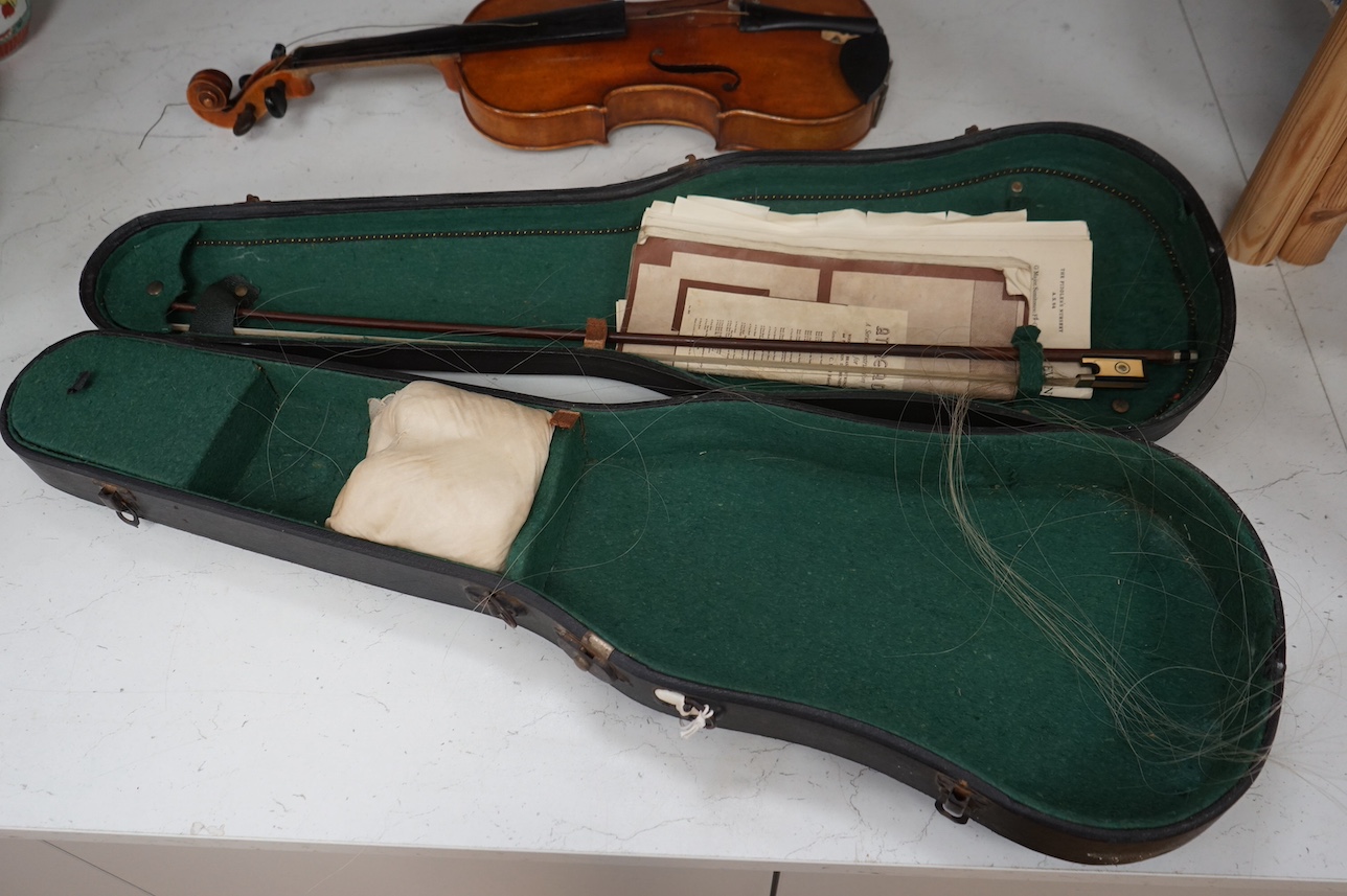 A cased full length violin, circa 1900 with bow, bears Stradivarius label to the interior. CITES Submission reference WVME8714